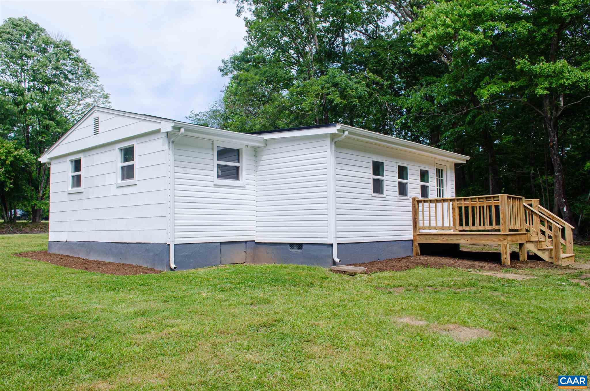 8121 Porters Road Esmont, VA 22937 - Photo 3 of 21 a view of a house with a yard and deck