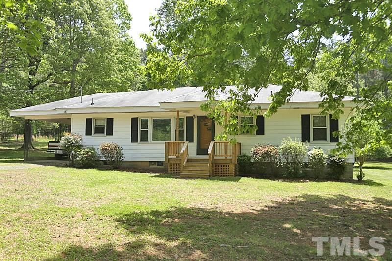 1707 Mason Road Durham, NC 27712 - Photo 1 of 17 a front view of a house with a yard