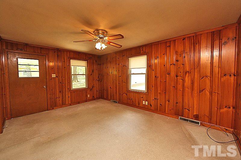 1707 Mason Road Durham, NC 27712 - Photo 3 of 17 an empty room with windows and fan
