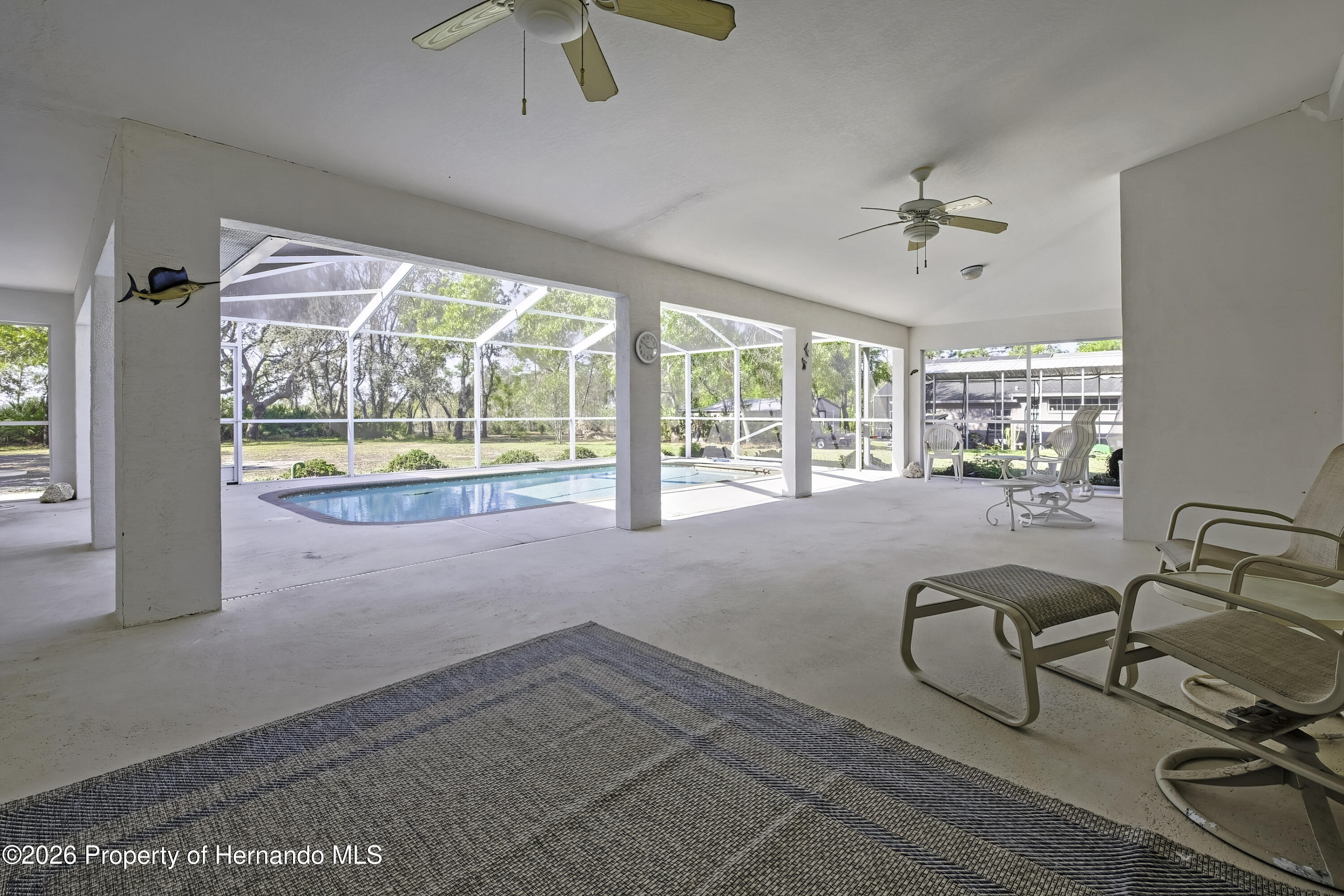 7250 Madrid Road Weeki Wachee, FL 34613 - Photo 42 of 63 Huge lanai area.