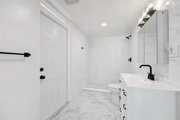 a bathroom with a sink and shower