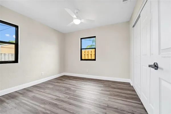 wooden floor in an empty room with a window