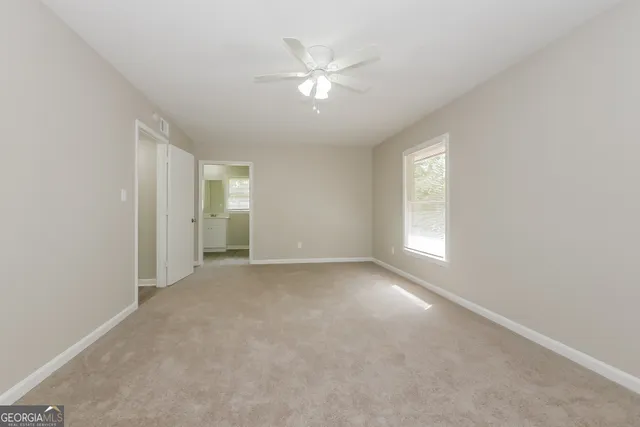 a view of an empty room with a window