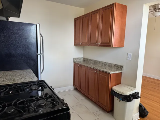 a kitchen with a stove and a cabinet