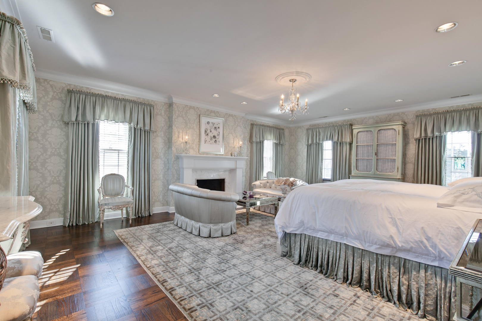 700 South Ridge Road Lake Forest, IL 60045 - Photo 17 of 47 a spacious bedroom with a bed and wooden floor