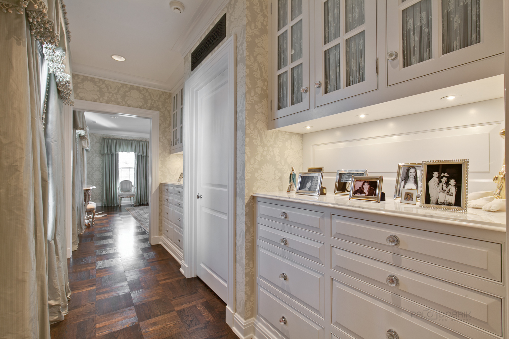 700 South Ridge Road Lake Forest, IL 60045 - Photo 18 of 47 a hallway with white cabinets and wooden floor