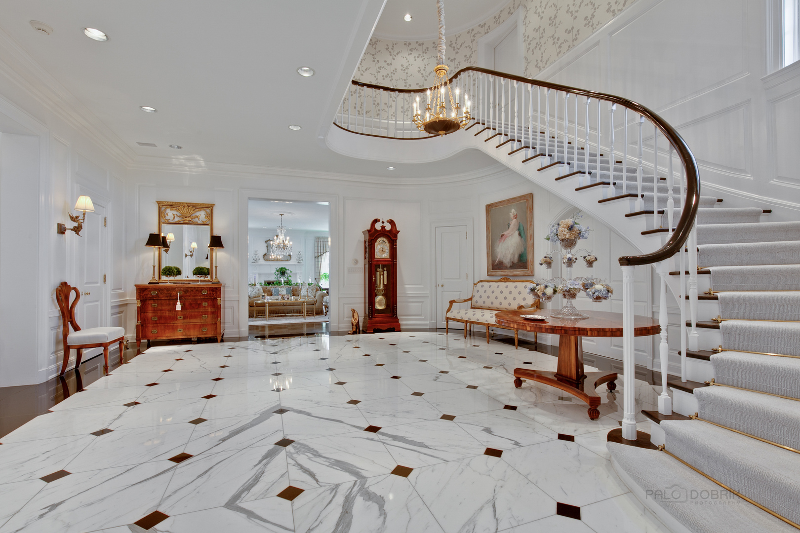 700 South Ridge Road Lake Forest, IL 60045 - Photo 3 of 47 a living room with furniture a chandelier and a dining table