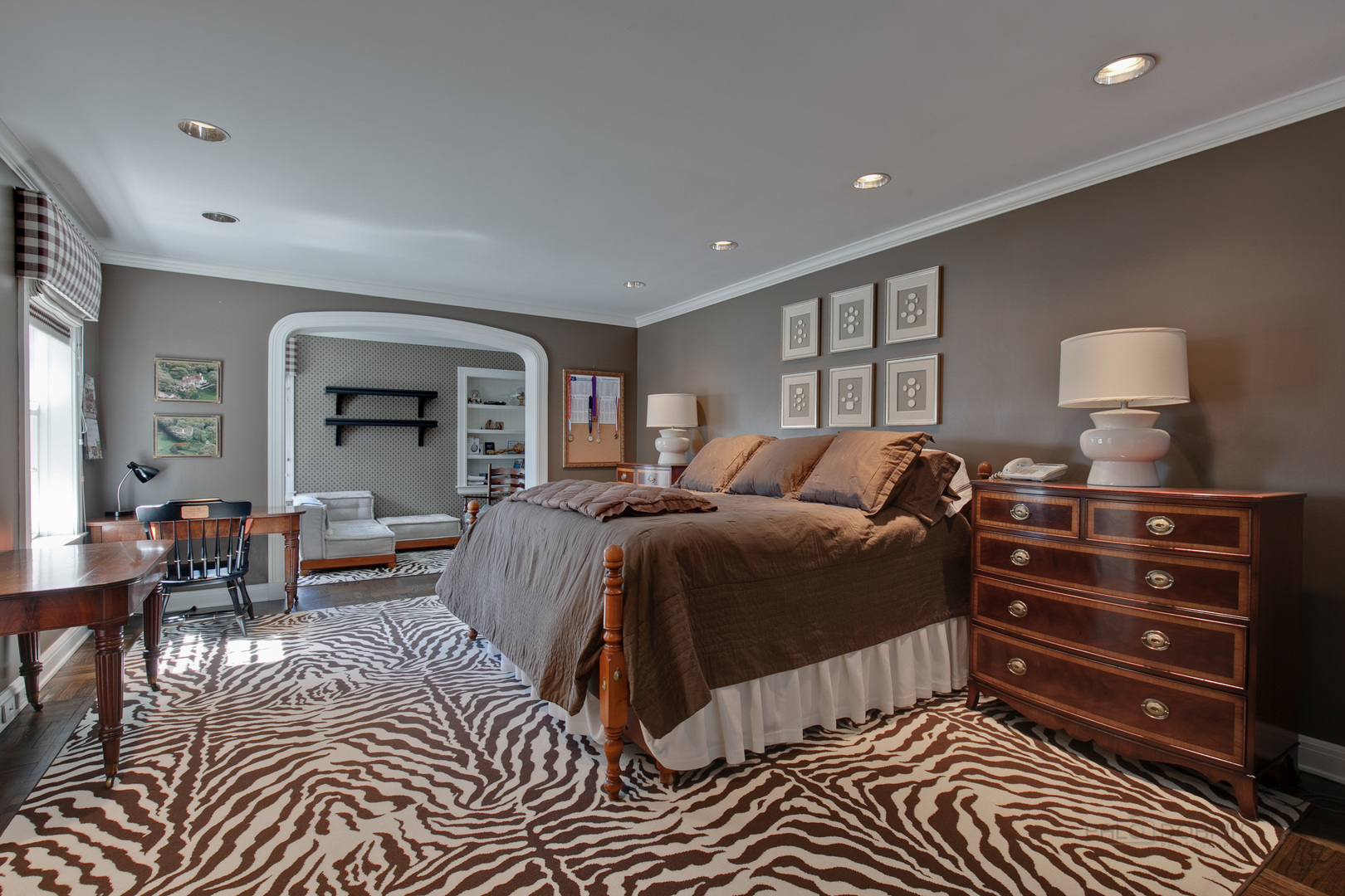 700 South Ridge Road Lake Forest, IL 60045 - Photo 27 of 47 a spacious bedroom with a bed a table and a dresser