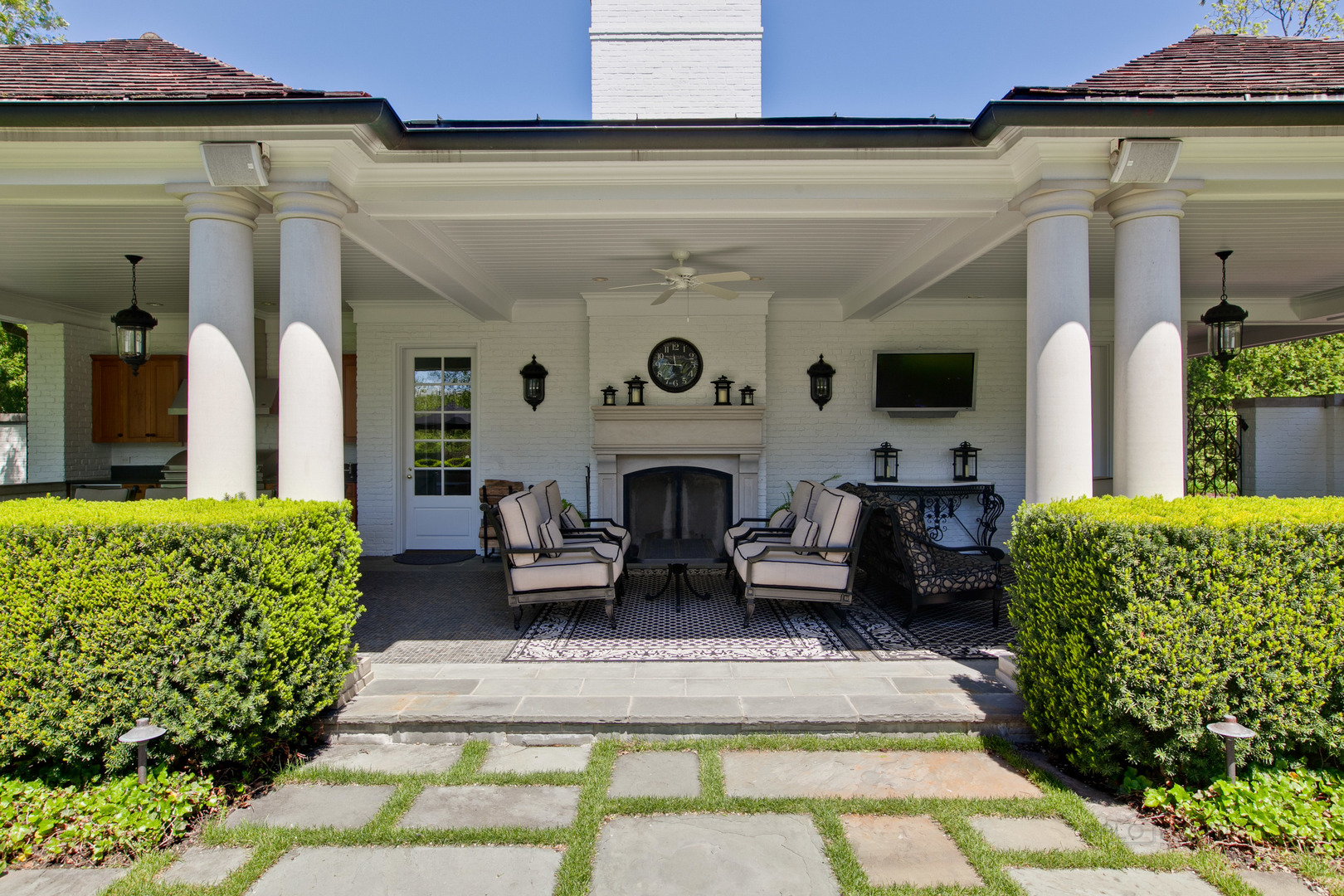 700 South Ridge Road Lake Forest, IL 60045 - Photo 33 of 47 a view of a patio with couches table and chairs and potted plants