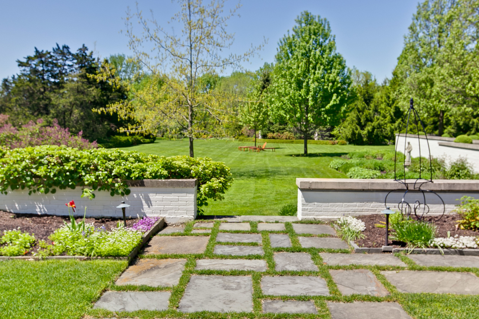 700 South Ridge Road Lake Forest, IL 60045 - Photo 37 of 47 a view of a garden with flowers and plants