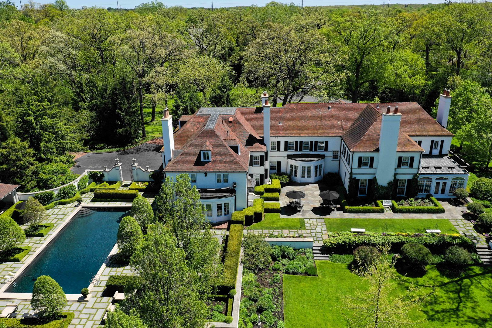 700 South Ridge Road Lake Forest, IL 60045 - Photo 41 of 47 an aerial view of a house with swimming pool patio and lake view