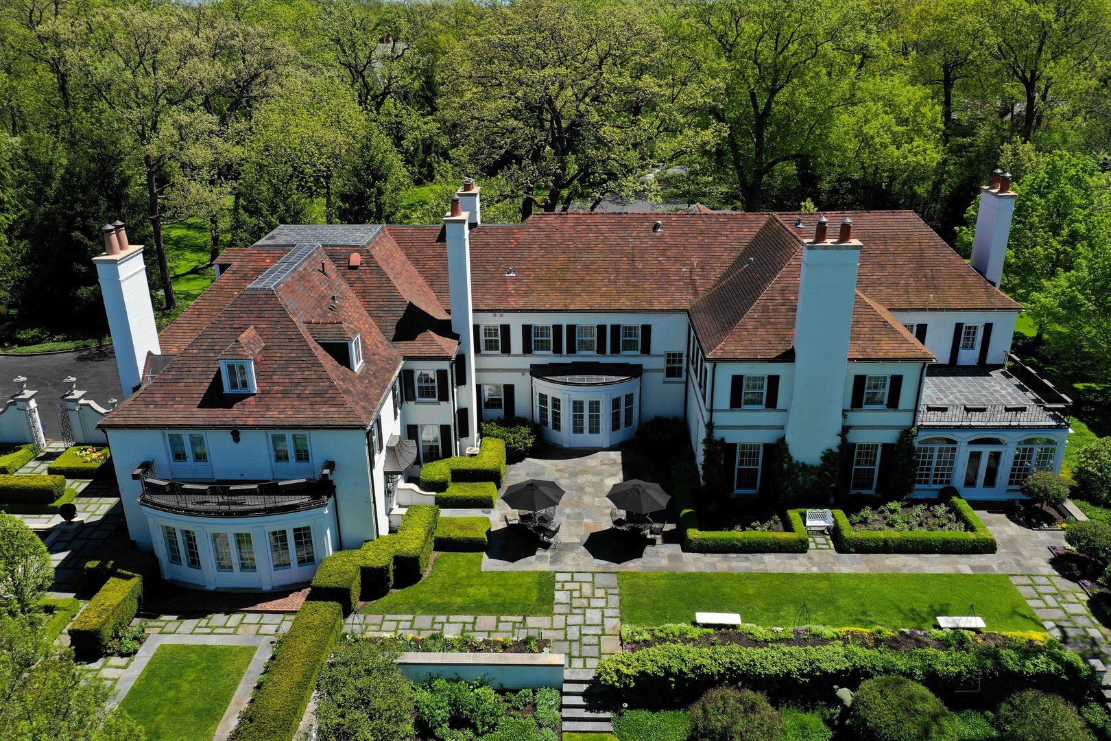 700 South Ridge Road Lake Forest, IL 60045 - Photo 42 of 47 a aerial view of a house with a yard table and chairs