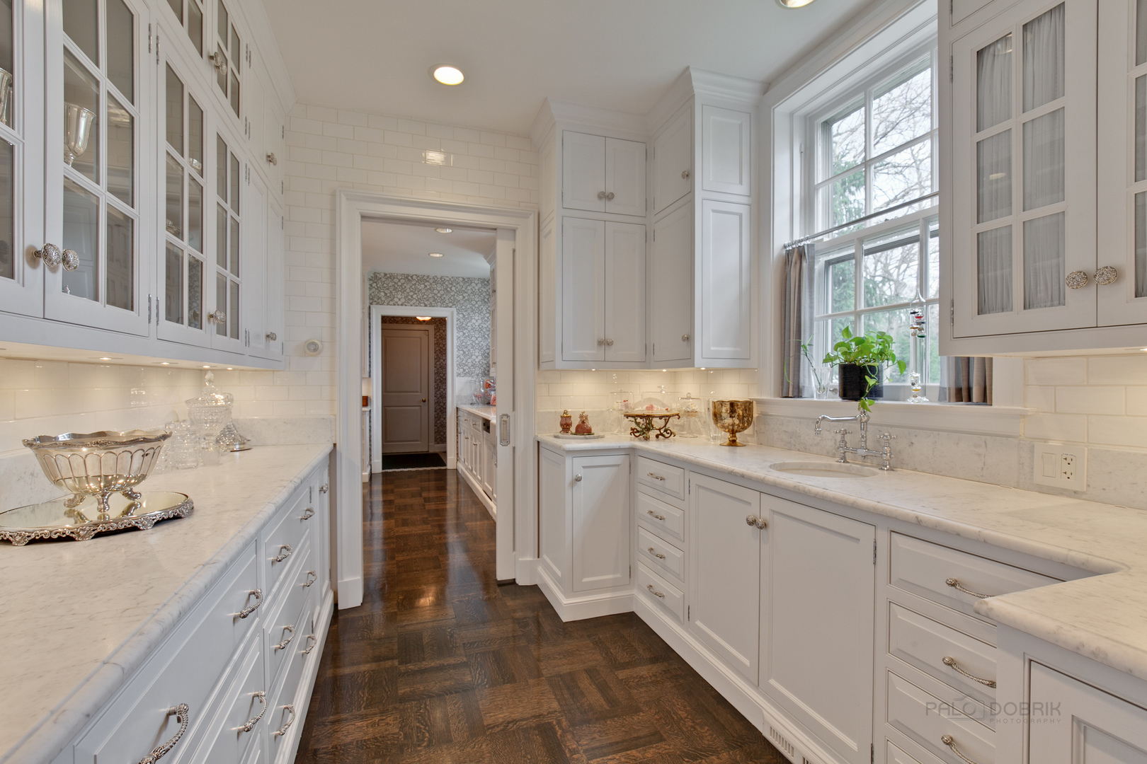 700 South Ridge Road Lake Forest, IL 60045 - Photo 10 of 47 a large white kitchen with stainless steel appliances granite countertop a lot of counter space and a sink
