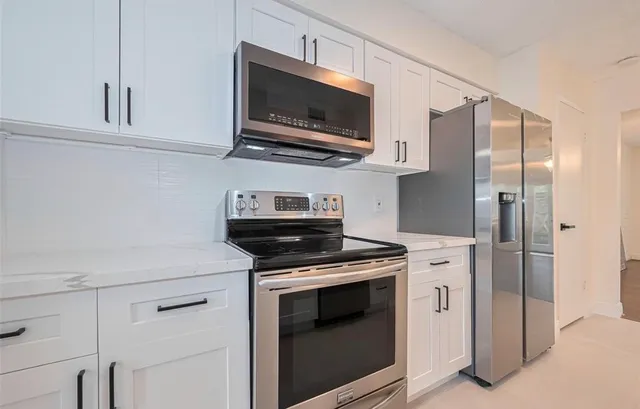 a bathroom with a sink toilet and mirror
