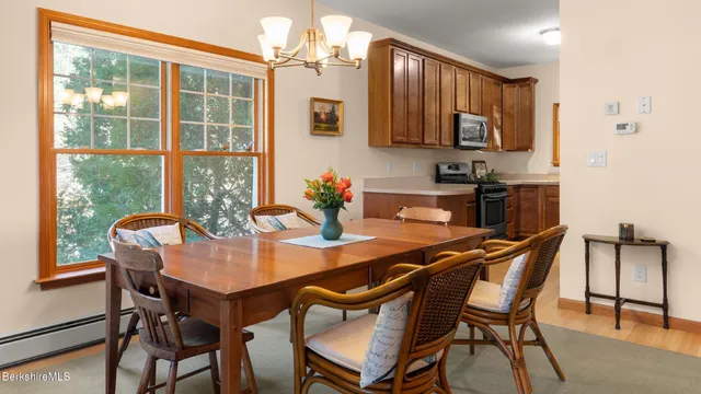 a dining room with furniture and window