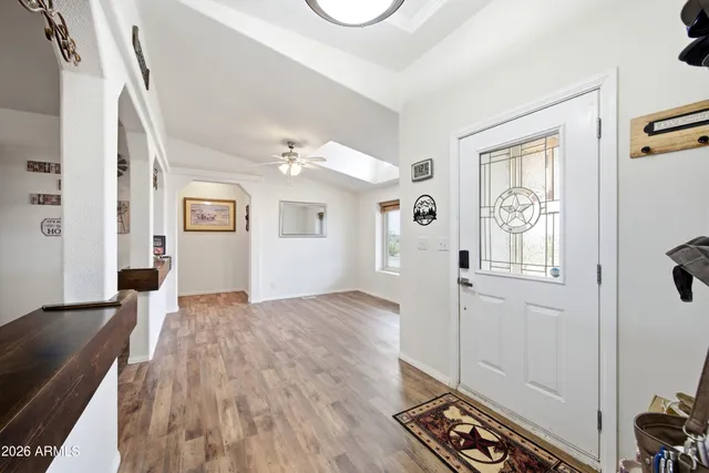 a en suite bathroom with a granite countertop tub and a sink