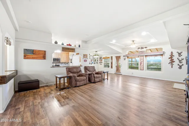 a view of livingroom with hardwood and furniture