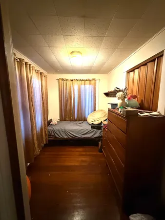 a bed room with a bed and a window