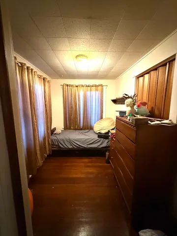 a bed room with a bed and a window