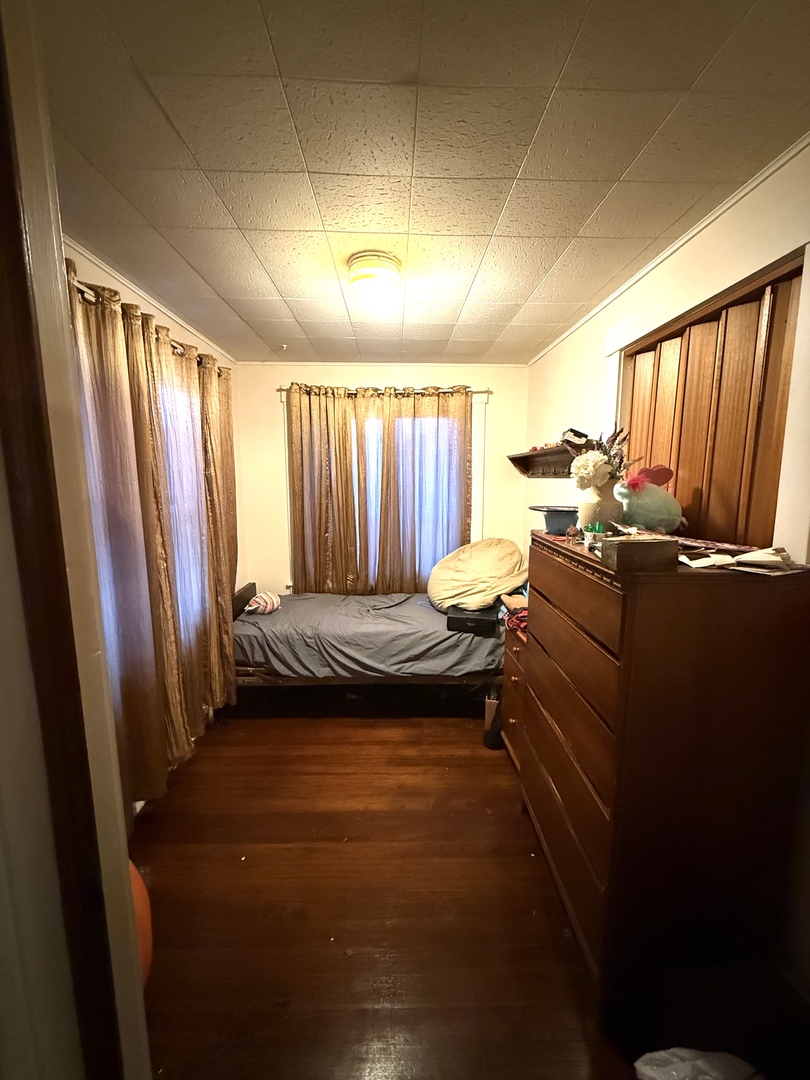 1611 West 3rd Street Dixon, IL 61021 - Photo 6 of 6 a bed room with a bed and a window