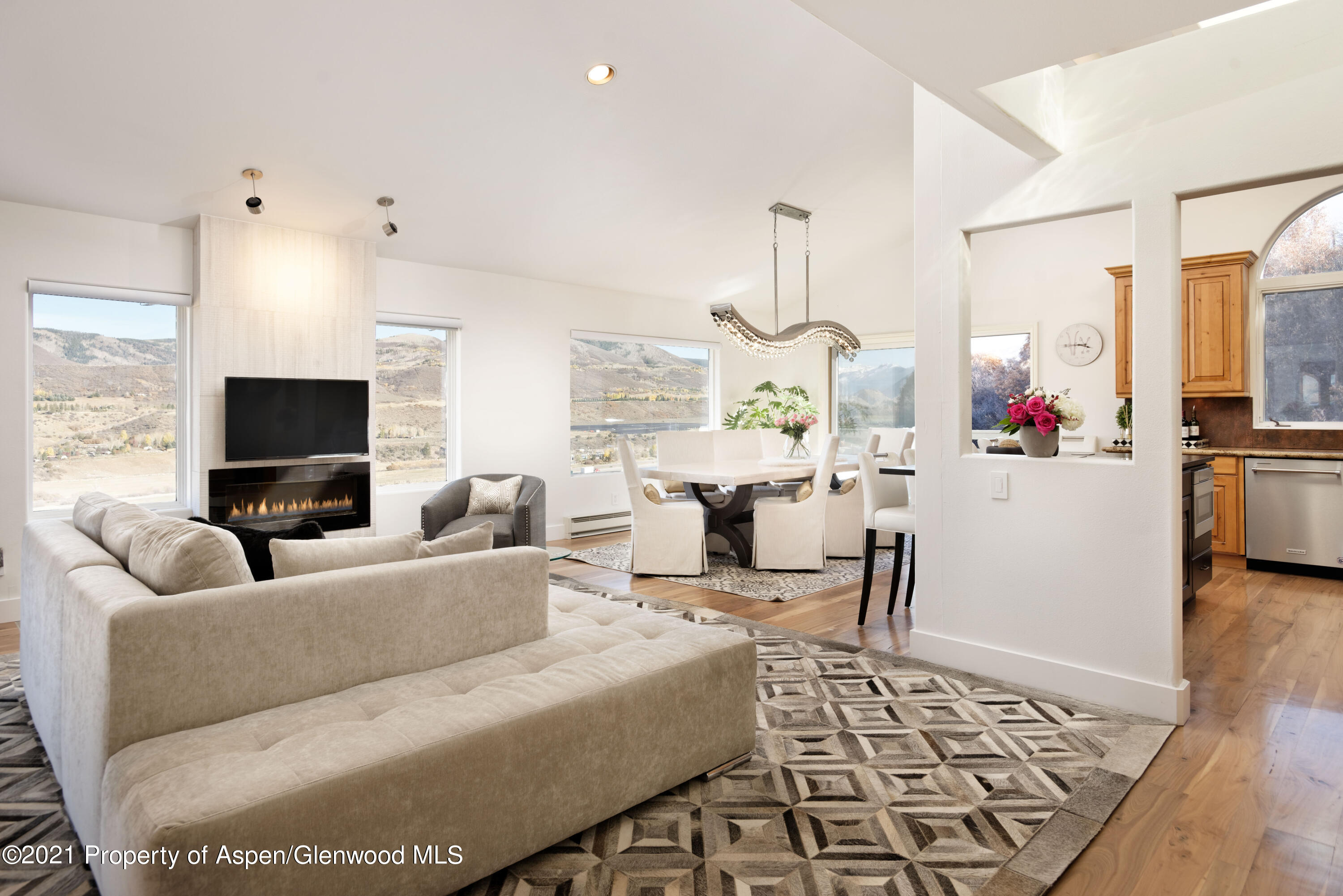 474 Upper Ranch Road Aspen, CO 81611 - Photo 1 of 43 a living room with furniture and a flat screen tv