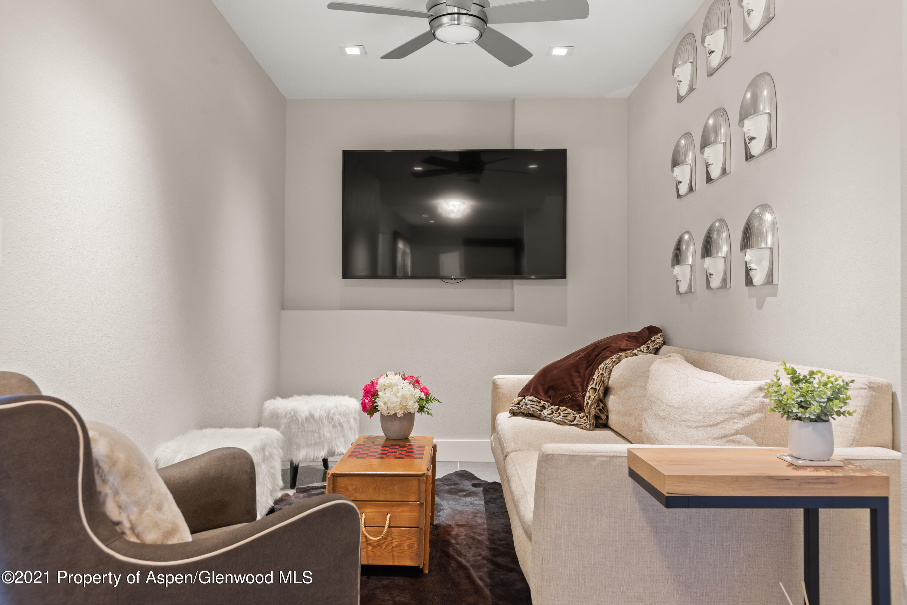474 Upper Ranch Road Aspen, CO 81611 - Photo 14 of 43 a living room with furniture and a flat screen tv