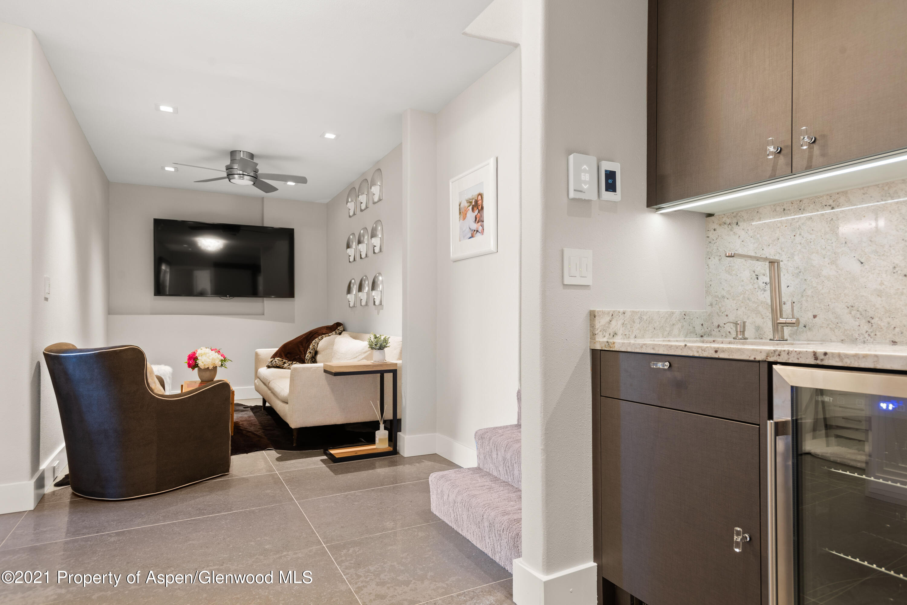 474 Upper Ranch Road Aspen, CO 81611 - Photo 15 of 43 a living room with furniture and a flat screen tv