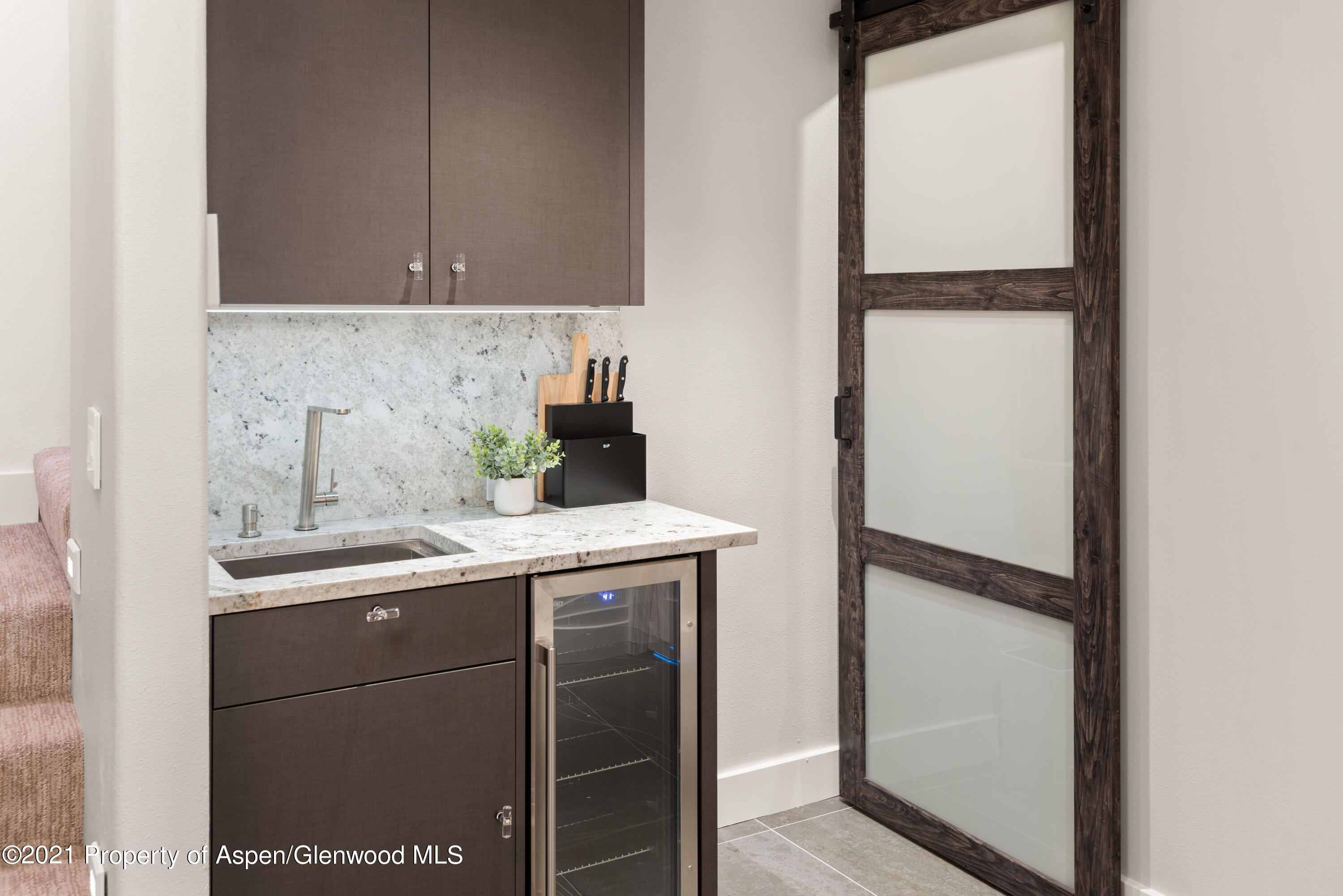 474 Upper Ranch Road Aspen, CO 81611 - Photo 17 of 43 a kitchen with a sink and a refrigerator