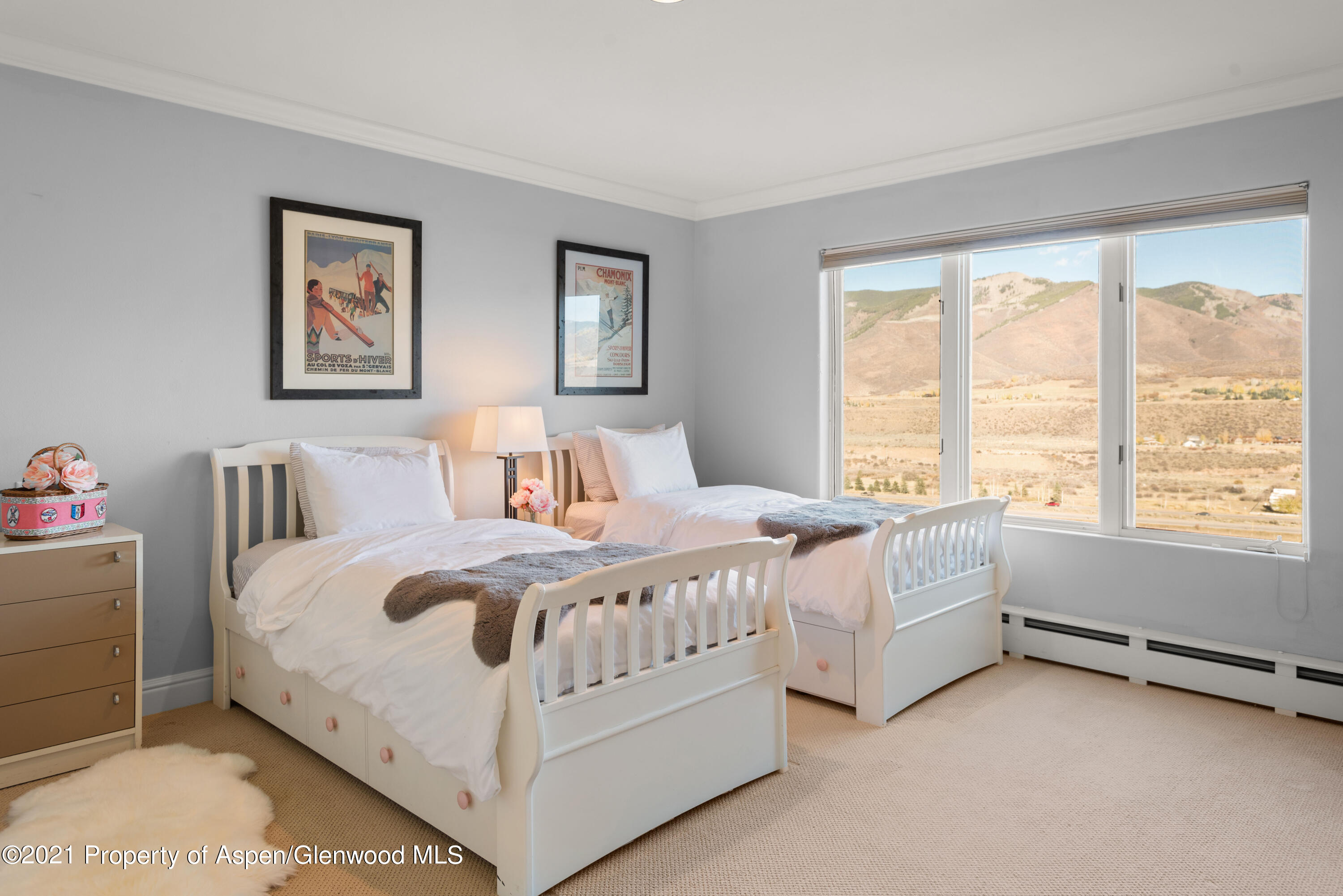 474 Upper Ranch Road Aspen, CO 81611 - Photo 18 of 43 a large white bed sitting in a bedroom next to a window
