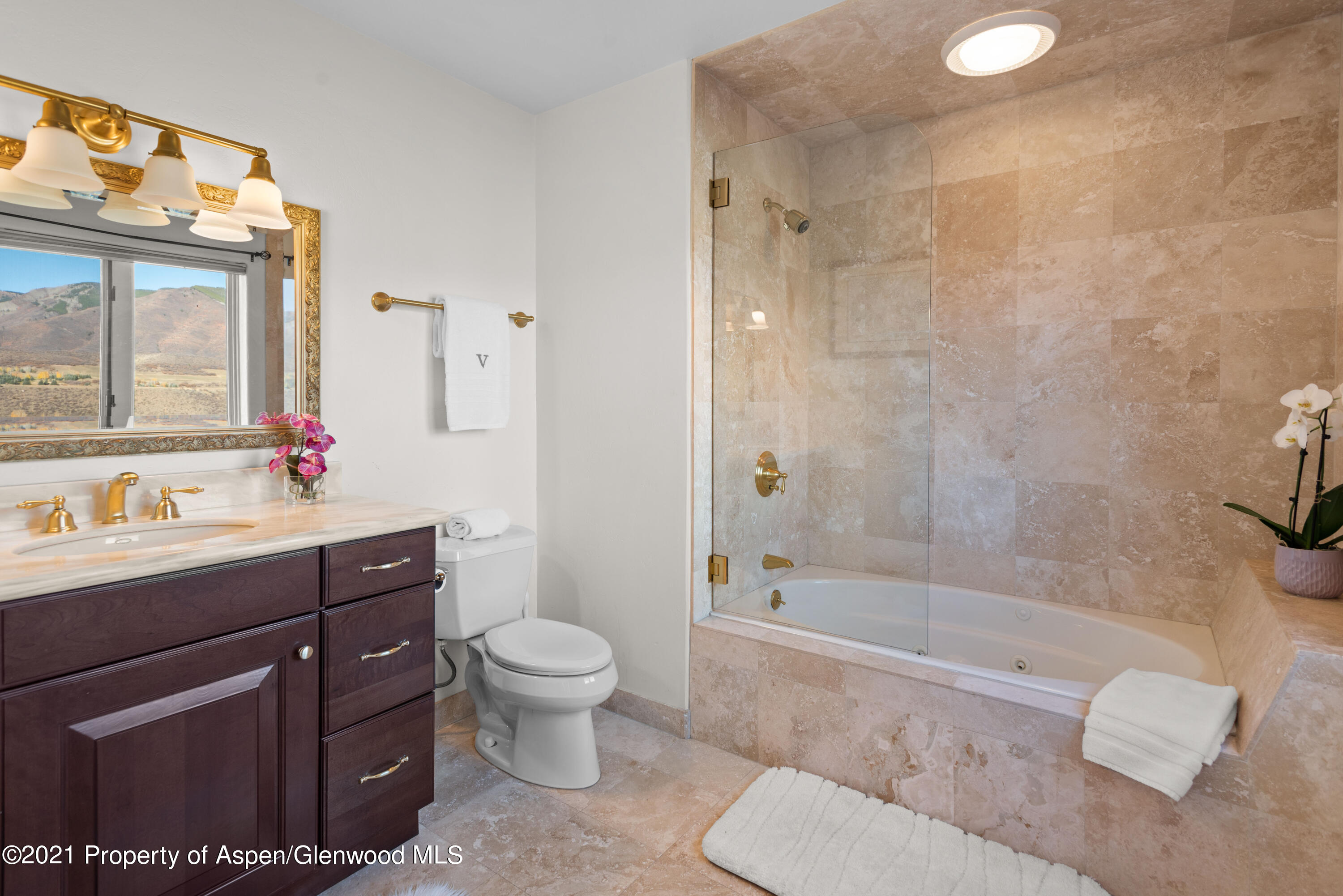 474 Upper Ranch Road Aspen, CO 81611 - Photo 24 of 43 a bathroom with a sink toilet a mirror and shower