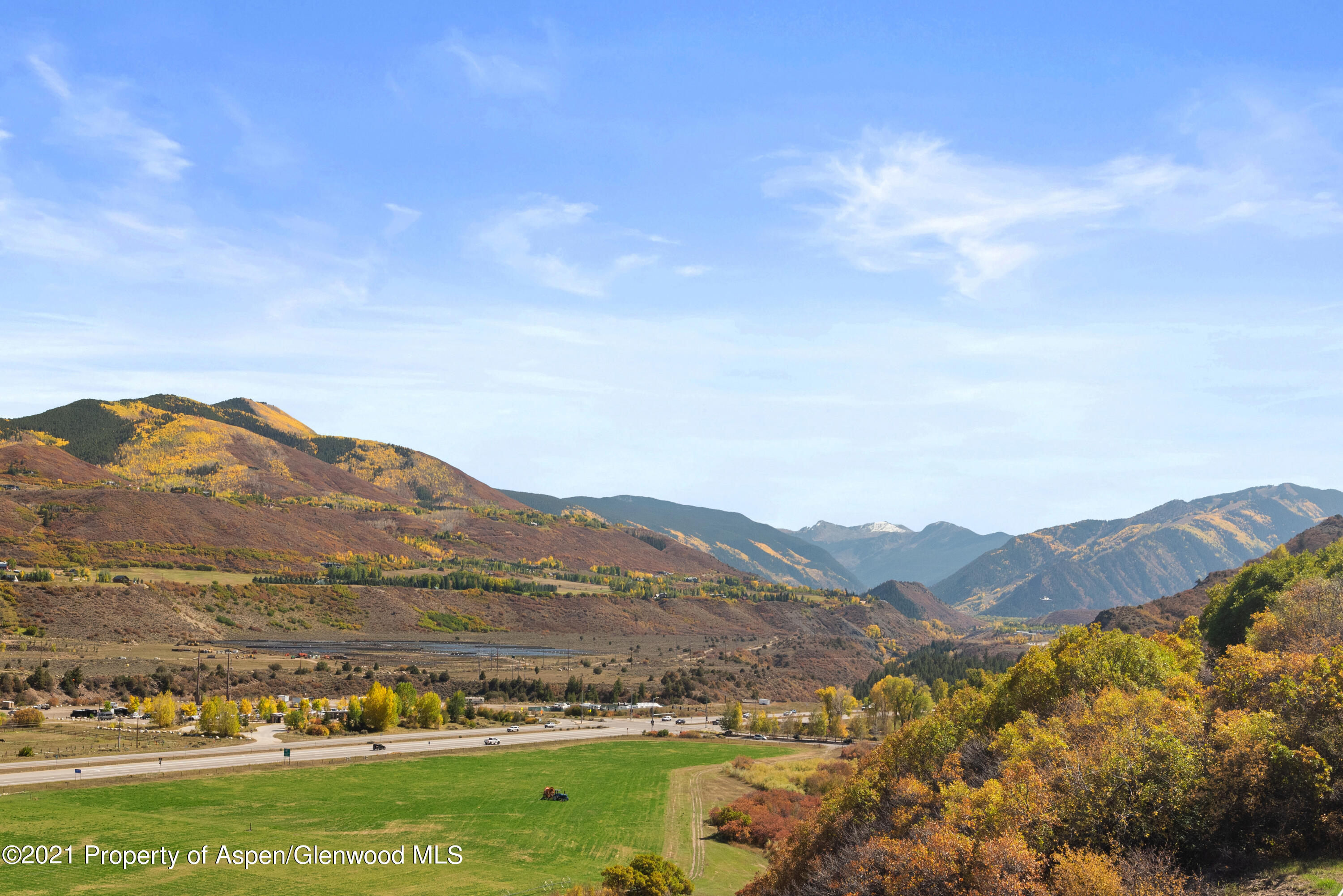 474 Upper Ranch Road Aspen, CO 81611 - Photo 35 of 43 a view of a town with mountains in the background
