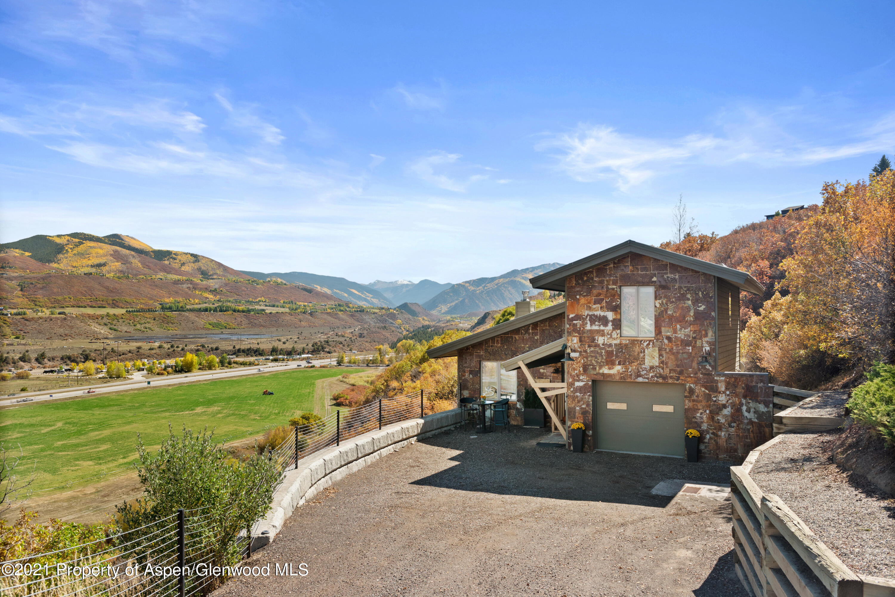 474 Upper Ranch Road Aspen, CO 81611 - Photo 42 of 43 a view of a terrace with a garden and chair