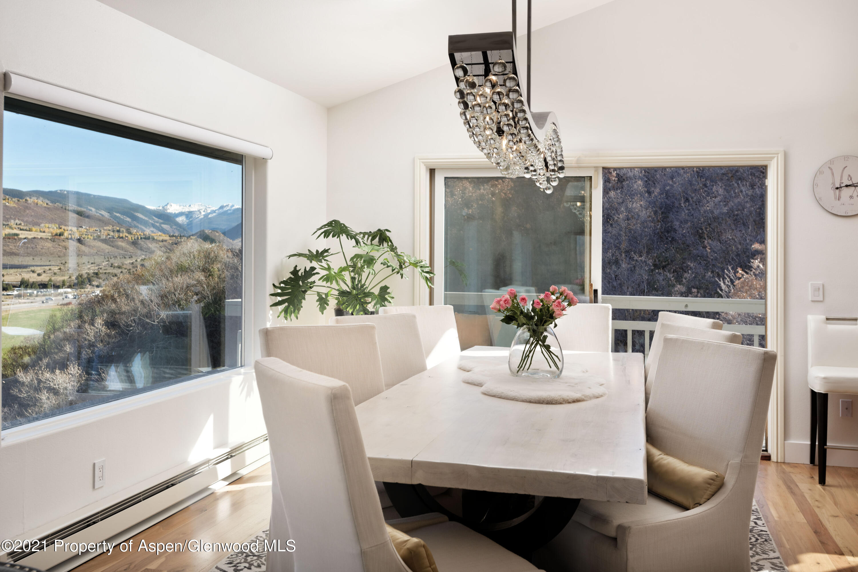 474 Upper Ranch Road Aspen, CO 81611 - Photo 7 of 43 a view of a dining room with furniture window and wooden floor