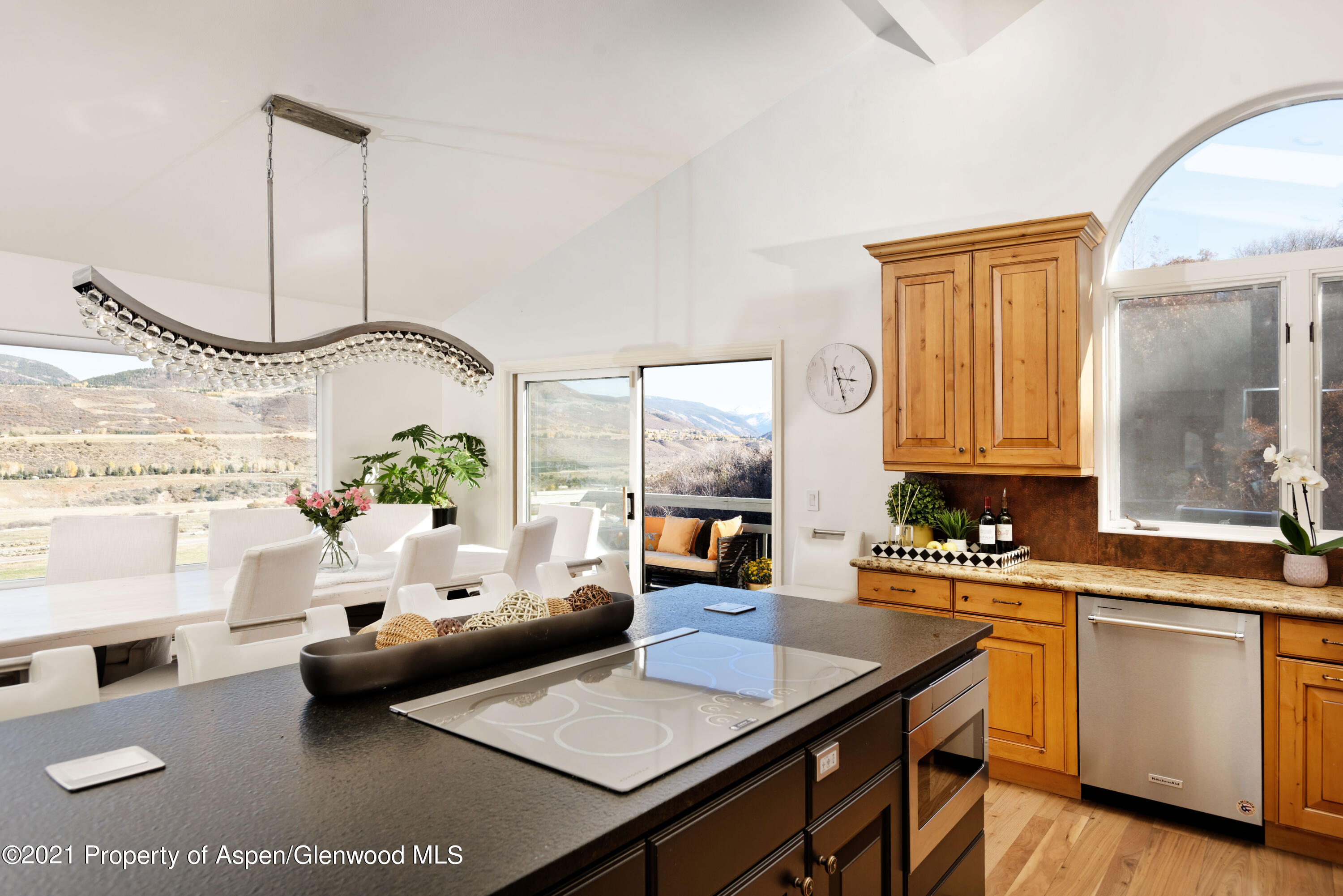 474 Upper Ranch Road Aspen, CO 81611 - Photo 8 of 43 a living room with granite countertop furniture a table and kitchen view