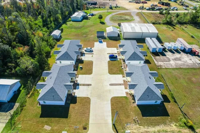 an aerial view of residential houses with outdoor space