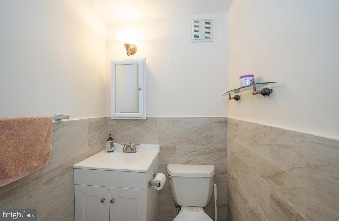 130 Crosshill Road Wynnewood, PA 19096 - Photo 6 of 9 a bathroom with a sink toilet and mirror