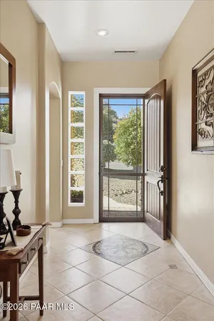 a view of a livingroom with a dining space and a window