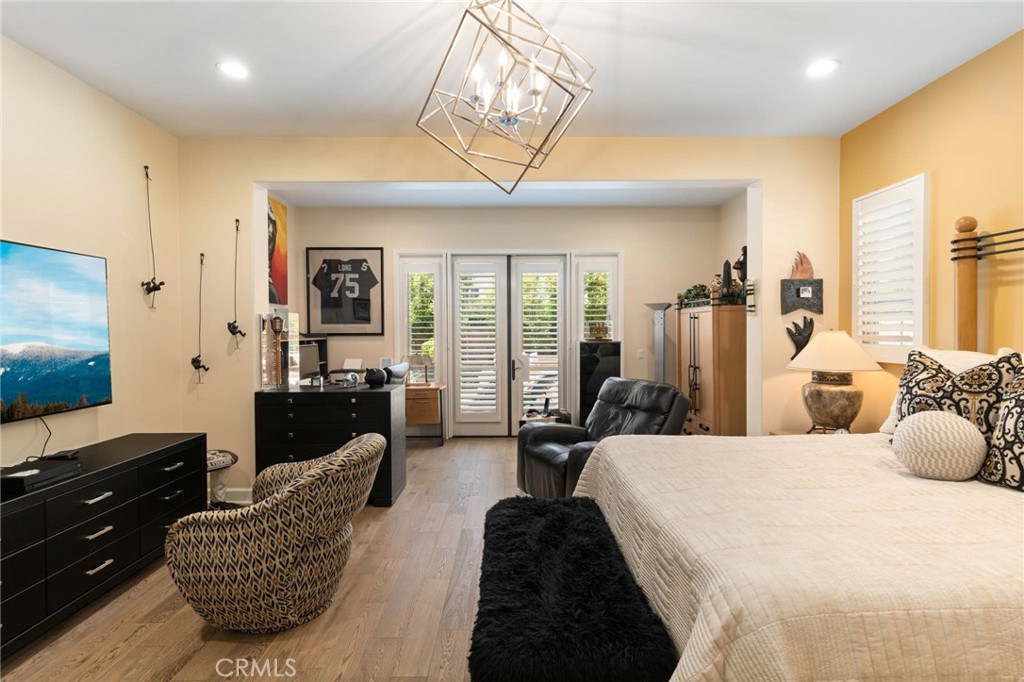 7 Zephyr Irvine, CA 92602 - Photo 21 of 52 a spacious bedroom with a bed a couch and large windows