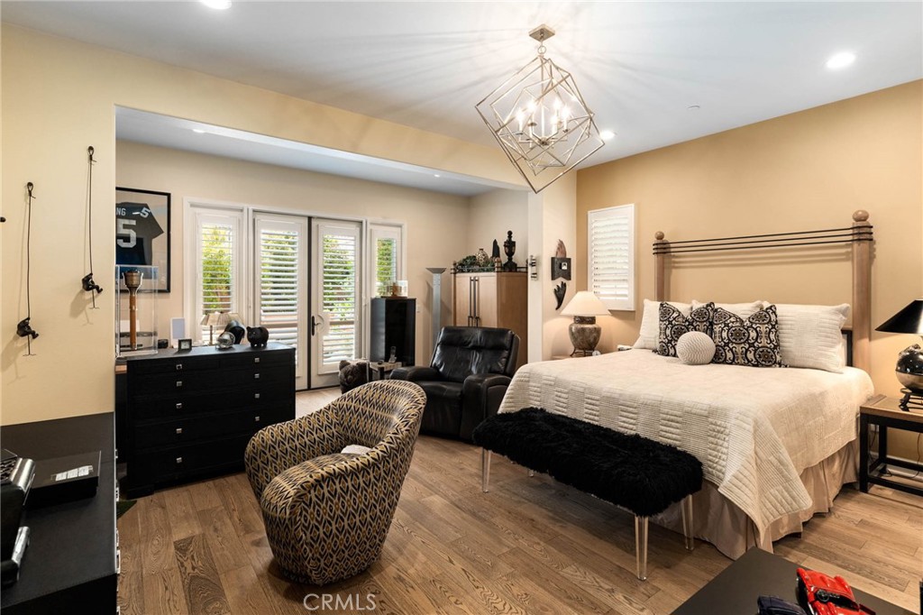 7 Zephyr Irvine, CA 92602 - Photo 22 of 52 a bed room with a bed and a chandelier