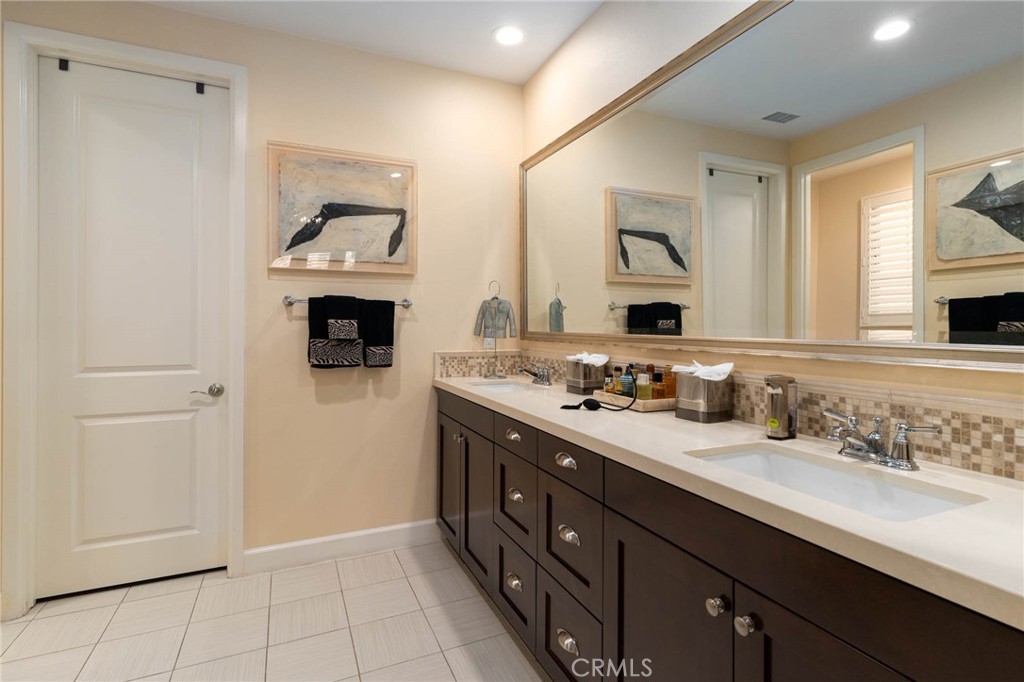 7 Zephyr Irvine, CA 92602 - Photo 23 of 52 a spacious bathroom with a double vanity sink mirror and