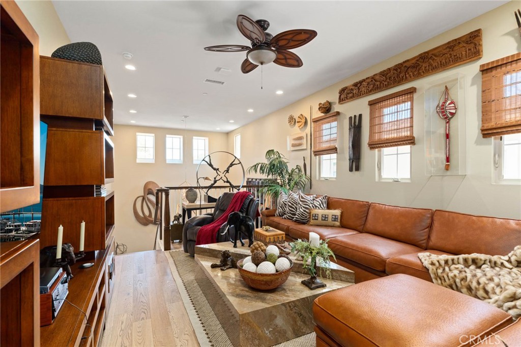 7 Zephyr Irvine, CA 92602 - Photo 27 of 52 a living room with furniture and wooden floor