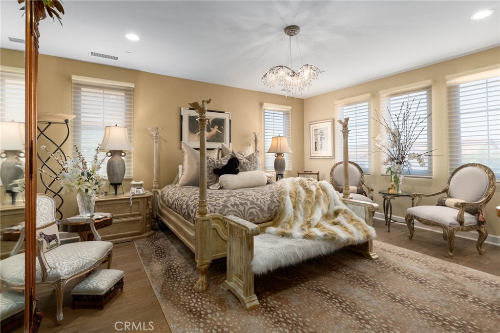 7 Zephyr Irvine, CA 92602 - Photo 29 of 52 a spacious bedroom with a bed a couch and dresser