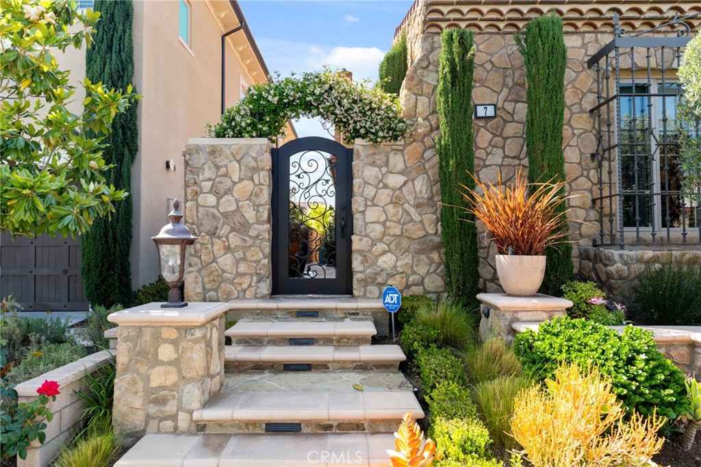 7 Zephyr Irvine, CA 92602 - Photo 3 of 52 a front view of a house with outdoor garden