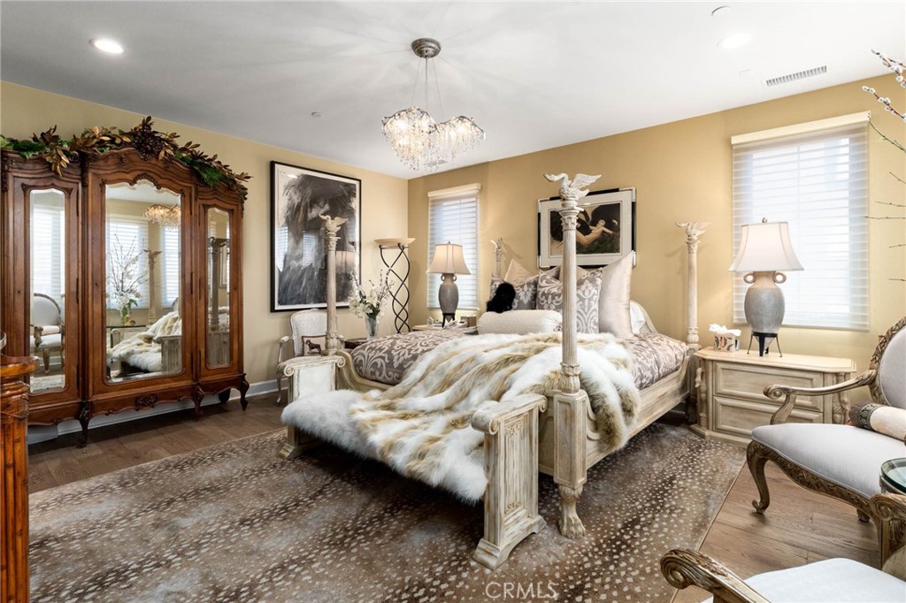 7 Zephyr Irvine, CA 92602 - Photo 31 of 52 a bedroom with a bed couch and large window with outer view