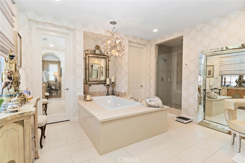7 Zephyr Irvine, CA 92602 - Photo 32 of 52 a spacious bathroom with a sink mirror and shower