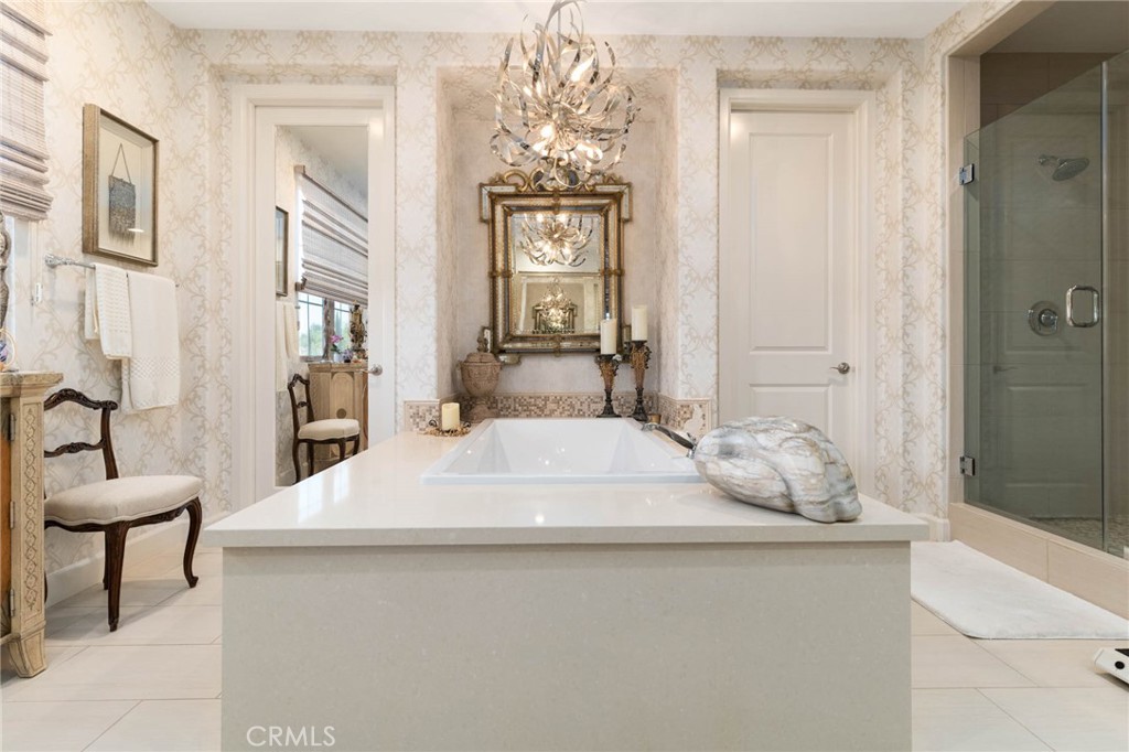 7 Zephyr Irvine, CA 92602 - Photo 33 of 52 a living room with furniture and a chandelier