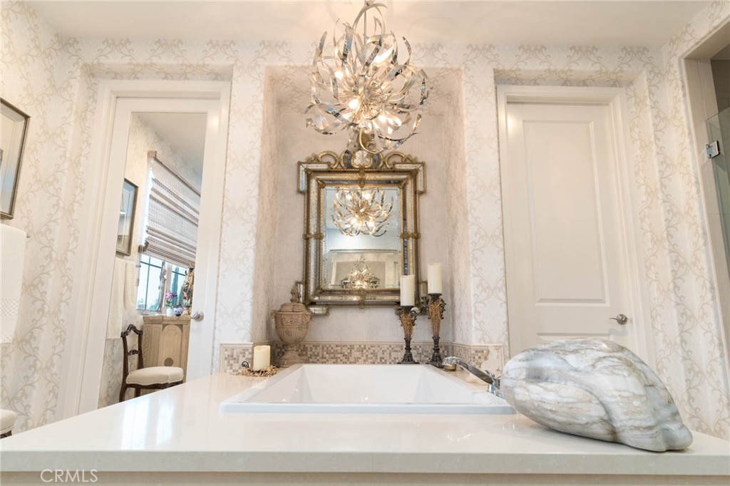 7 Zephyr Irvine, CA 92602 - Photo 34 of 52 a bathroom with a bathtub sink and mirror