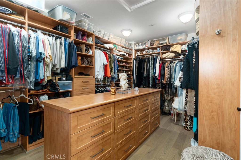 7 Zephyr Irvine, CA 92602 - Photo 37 of 52 a view of walk in closet with clothes and shoes