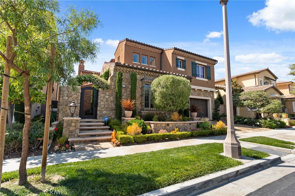 7 Zephyr Irvine, CA 92602 - Photo 4 of 52 a front view of a house with a yard