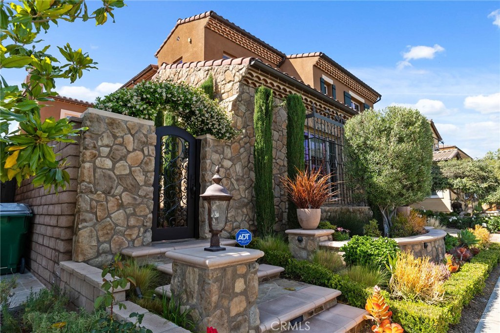 7 Zephyr Irvine, CA 92602 - Photo 5 of 52 a front view of a house with garden